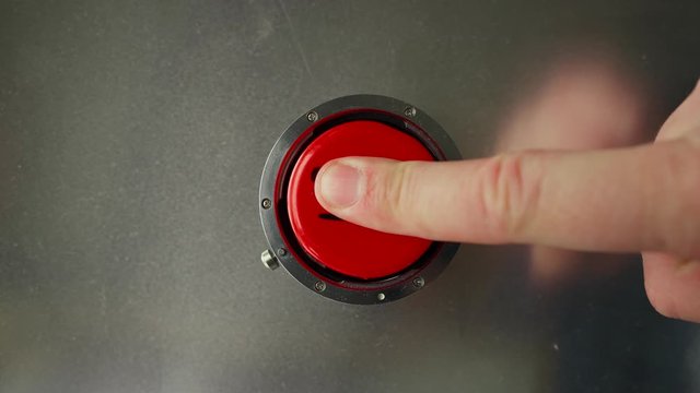 Finger presses the red button with the inscription start