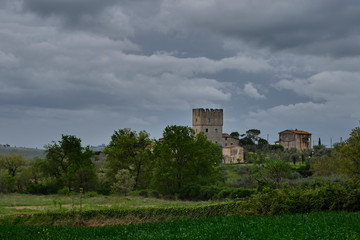 A little castle on the hill. Solo Backpacker Trekking on the Via Francigena from Lucca to Siena. Walking between nature, history, churches,