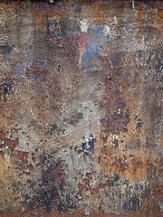 Old rusty scratched metal surface with paint wrapping element for graphic design (mobile photography)