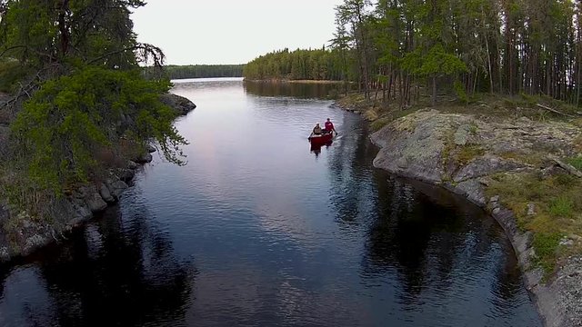 Paddling a river between two lakes in the rocky Canadian Shield country of eastern Manitoba.