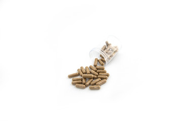 Drug capsule pills with beige medication in pile