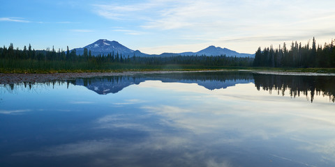 Early morning panoramic view of the South Sister mountain from the Hosmer Lake in Central Oregon.