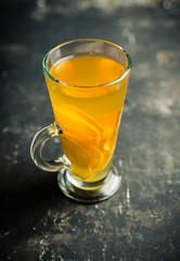 Healthy hot beverage with lemon, ginger and spices for protection in flu season. Selective focus. Shallow depth of field.