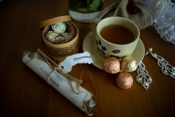 cup of tea and cookies on wooden table
