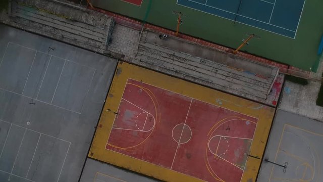 Rotating Aerial drone shot over basketball courts in a sports complex in Poseidonio, Thessaloniki Greece