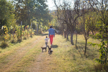 Fototapeta premium Granny and her grandson in a walk on the countryside