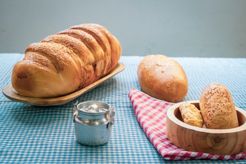 Baked breads on wooden table background.
