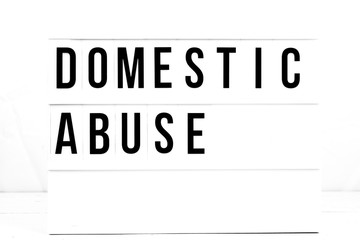 Domestic Abuse Awareness Sign on Vintage Retro Board. 