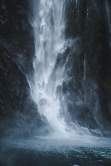 Fototapeta na wymiar Waterfall hitting the ocean 