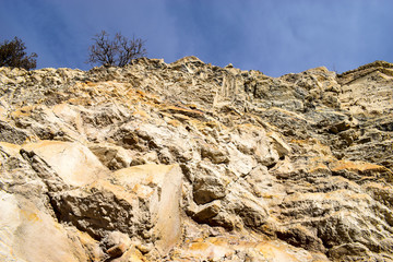 Detail of the sandstone and limestone rock face compressed by centuries, Dinosaur Ridge, Colorado, USA