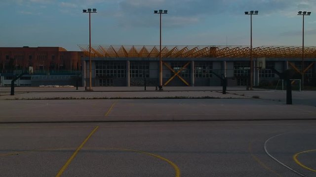 Aerial drone shot over basketball courts in a sports complex in Poseidonio, Thessaloniki Greece