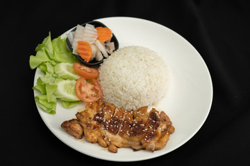Rice with teriyaki chicken grill with side dish of vegetables (Chicken Teriyaki don in Japanese Style) - Black background , Horizontal  
