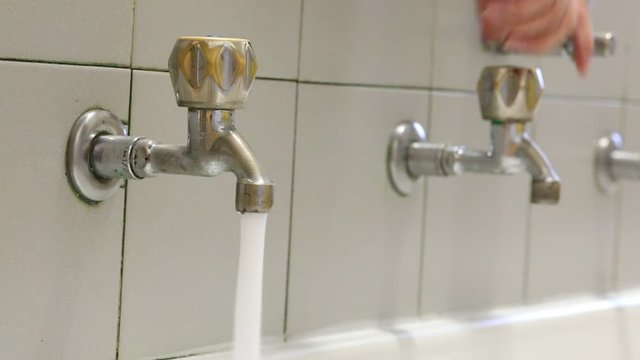 Person who closes the water taps to avoid waste