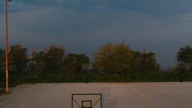 Ascending Aerial drone shot over basketball courts in a sports complex in Poseidonio, Thessaloniki Greece
