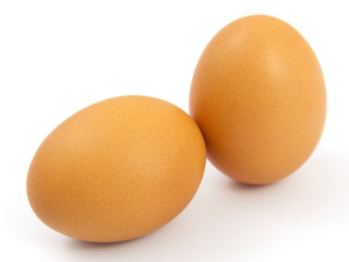 Brown eggs on white background