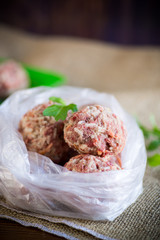 frozen raw meatballs from beef and pork with carrots and rice