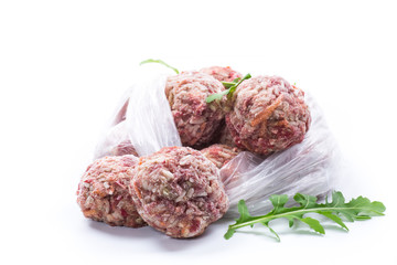 frozen raw meatballs from beef and pork with carrots and rice
