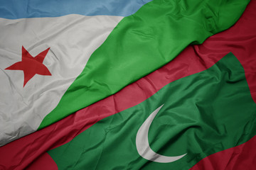 waving colorful flag of maldives and national flag of djibouti.