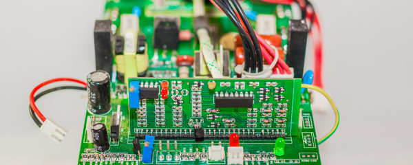 electrical board with electronic components, close up blurry background