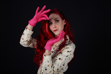 Studio portrait of beautiful young woman with chili pepper