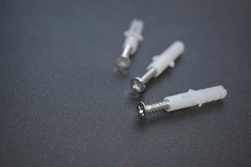 Three dowels on a black background.