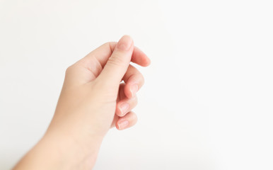 Close up woman hand with nails form of soft square holds something in fingers. Female keeps virtual...