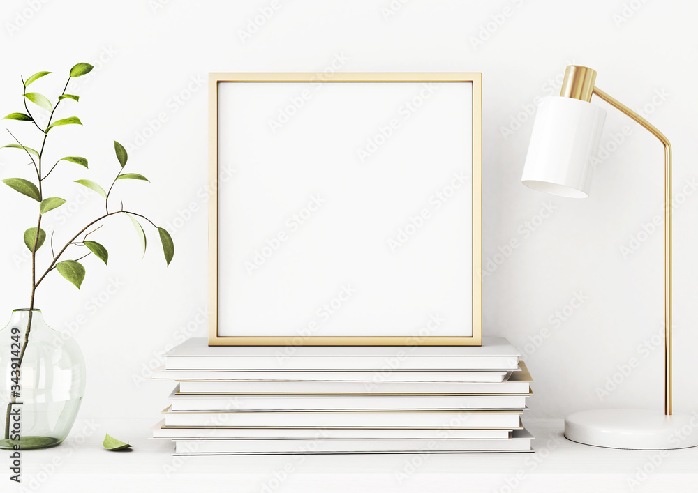 Aufkleber interior poster mockup with square gold metal frame on pile of books, green tree branch in vase and 