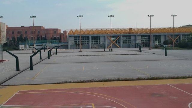 Aerial drone shot over basketball courts in a sports complex in Poseidonio, Thessaloniki Greece