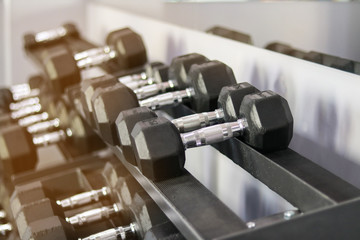 black dumbbells are in the gym for sports after quarantine