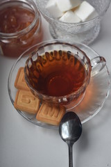 tea with sugar and jam, a beautiful cup and teapot