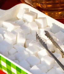Sugar cubes or fructose cubes displayed in a box