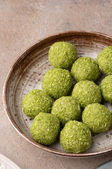 Match truffle with matcha tea sprinkled with a mixture of matcha and coconut.