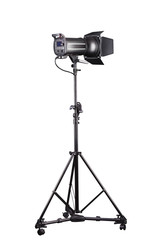 Photography studio flash on a lighting stand isolated on white background.