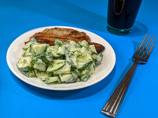 chicken steak and cucumbers in yogurt