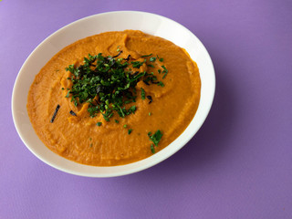 pumpkin cream soup in a white plate