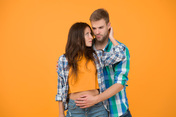 Sexy couple checkered shirts. Family look. Matching outfits. Summer season. Fashion clothes shop. Modern couple. Carefree students hang out together. Love and romance. Man and girl. Couple in love