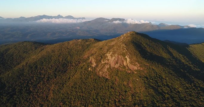Drone shot of a mountain with the sunset light