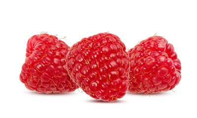 Three raspberries isolated on white background