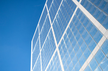 Fototapeta na wymiar skyscraper of commercial modern city of future. Business Technology Industry. concept of success. bright future. Modern building architecture. sky reflects in mirror glass. city architecture concept