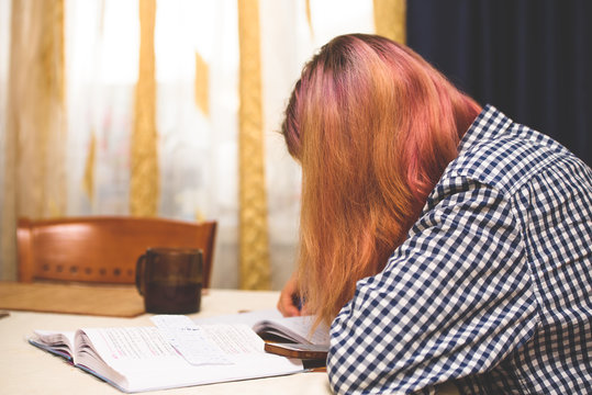 A girl performs a school task at home-distance learning during the coronavirus pandemic