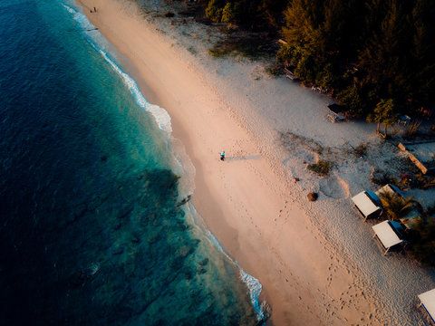 Aerial view of sandy beach and turquoise water in Lhoknga, Aceh, Indonesia.