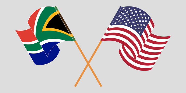 Crossed and waving flags of South Africa and the USA