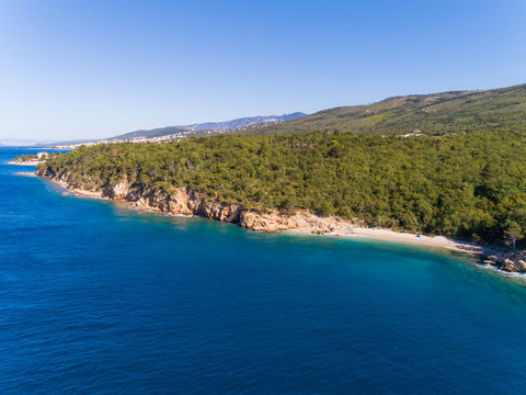 Aerial view of FKK beach surrounded by trees in Crikvenica, Croatia.