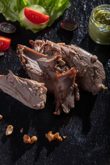 grilled duck on a wooden cutting board