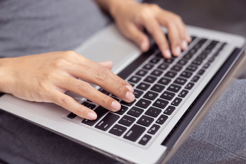 Hand typing on  computer keyboard. . Business and Technology Concepts.