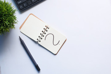 high angle view of question mark on notepad