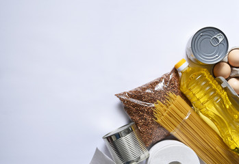 Food donations: butter, eggs, groceries, toilet paper. Food delivery. Groceries on a white...