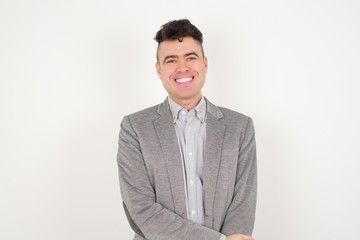 Positive human facial expressions and emotions. Isolated shot of attractive student  looking and smiling broadly at camera during nice conversation with someone.