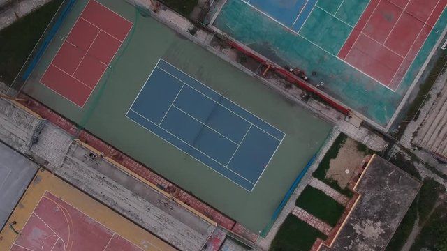 Rotating Aerial drone shot over tennis court in a sports complex in Poseidonio, Thessaloniki Greece