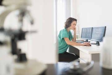 Female technician working on computer